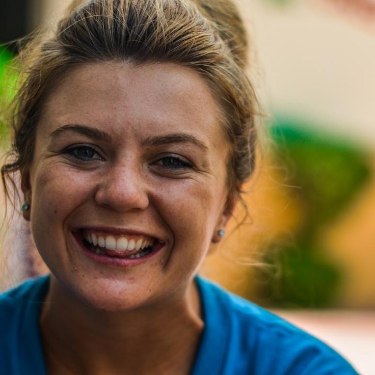 Kaveri Mehta, Lead Design Curator at BeeCapMap, reviewing corporate floral arrangements